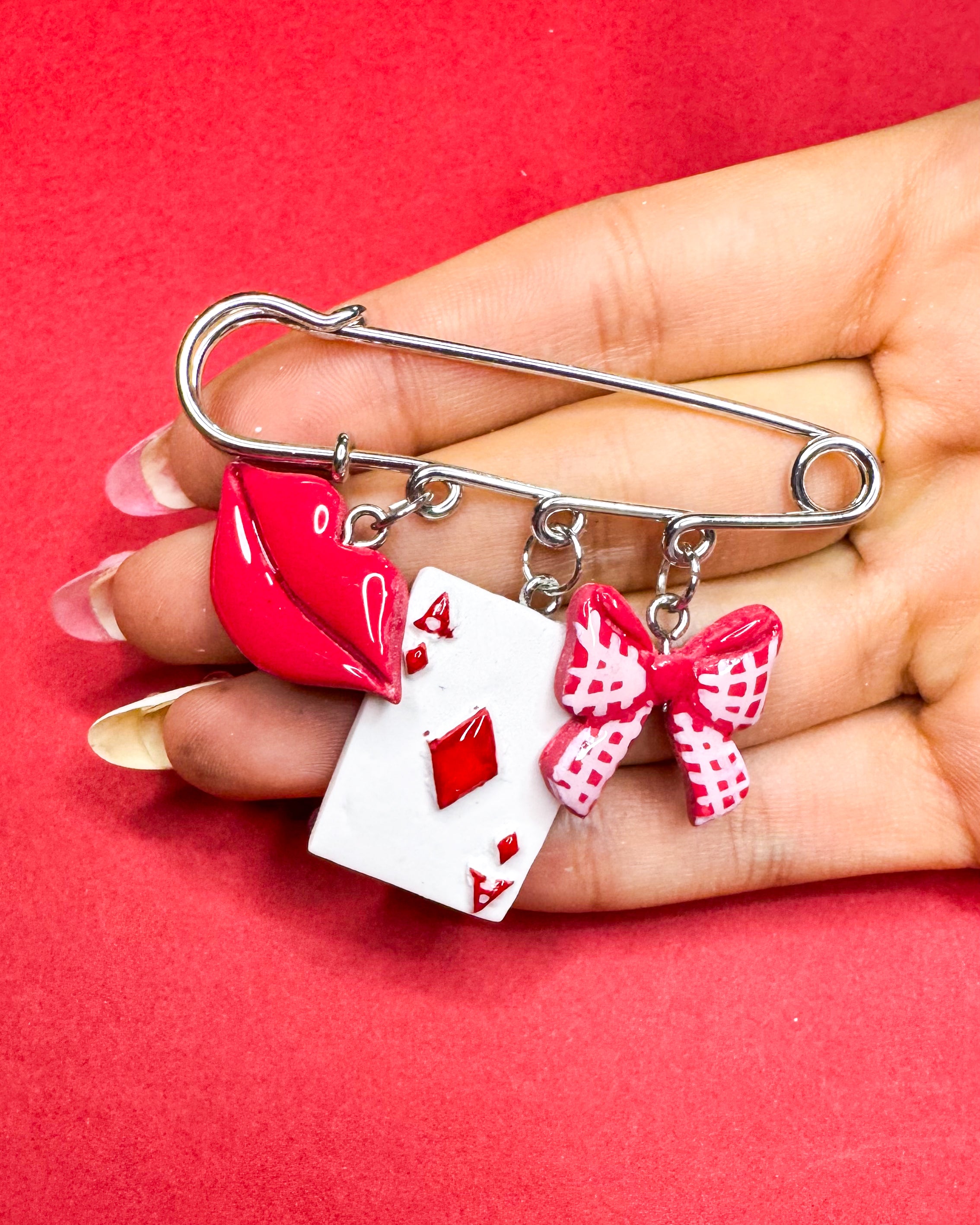 Beso ganador | Prendedor