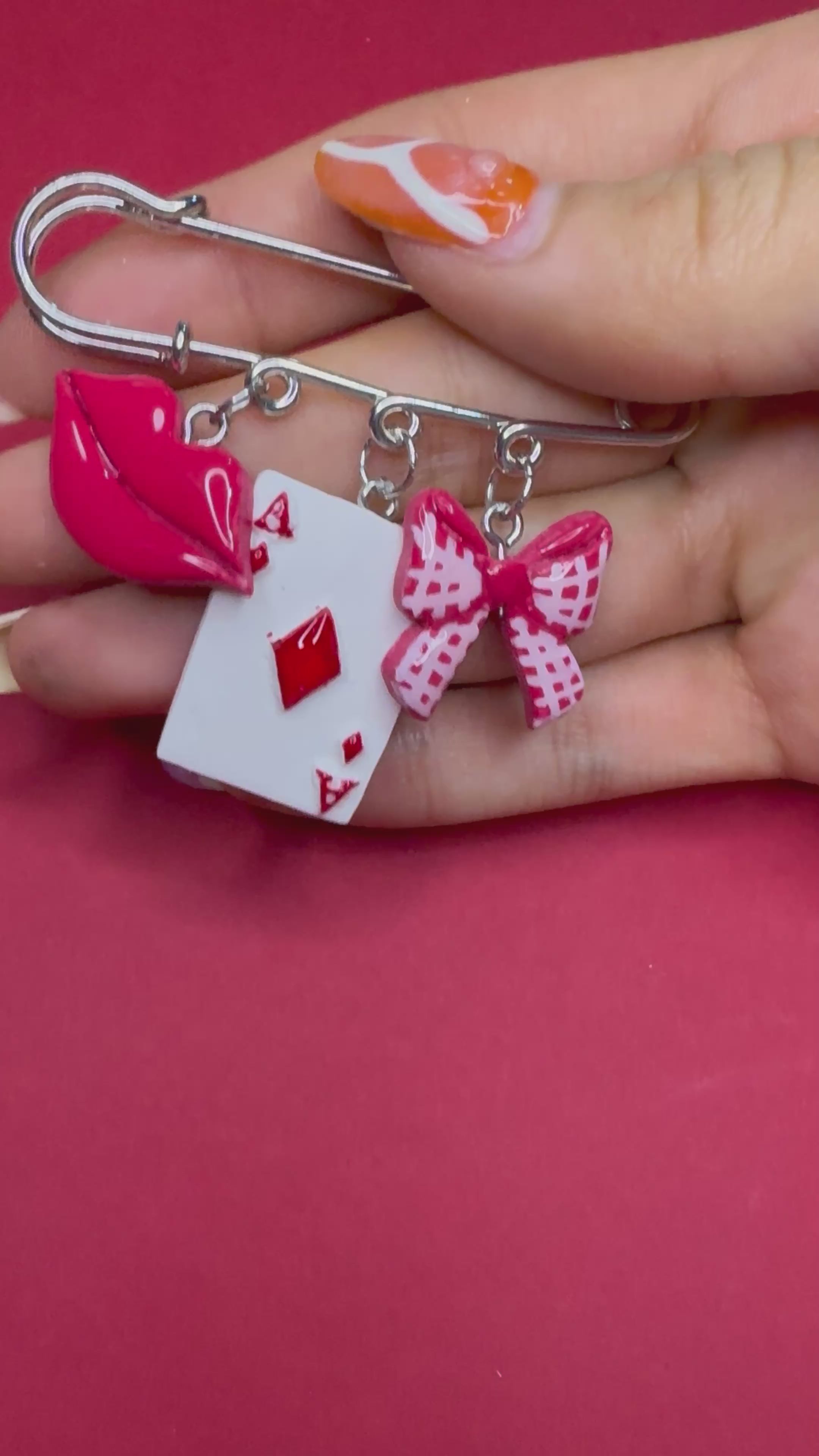 Beso ganador | Prendedor